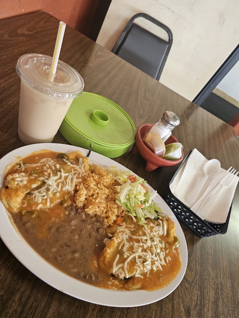 Mexican restaurant interior with simple tables and chairs.