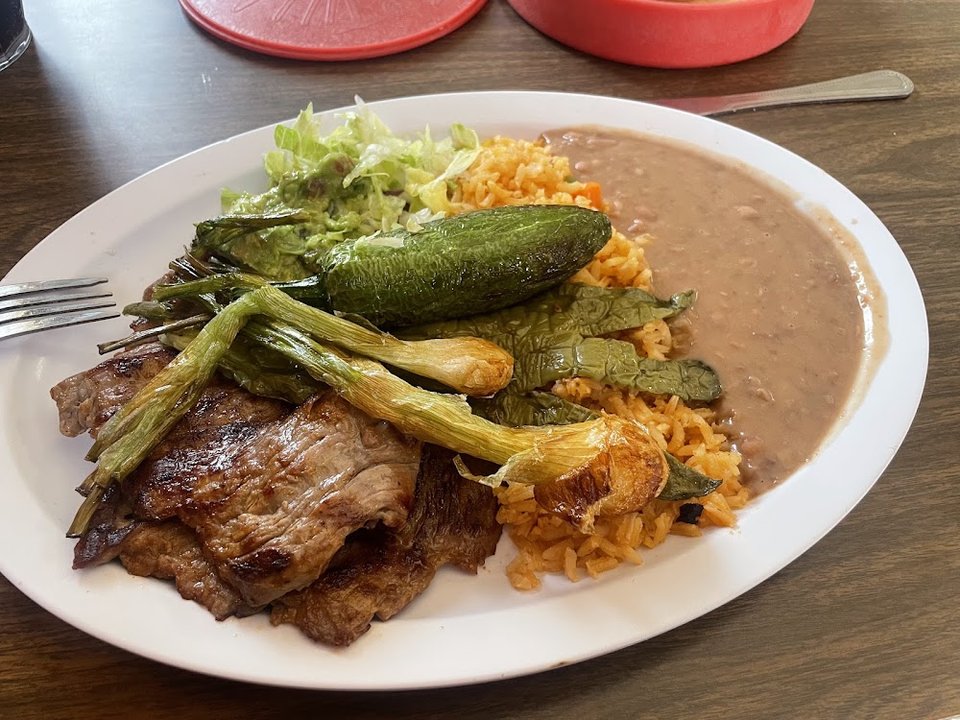 Printed menu with breakfast, fajitas, and soups.